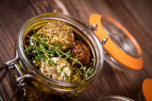 RECIPE FOR LABNEH CHEESE BOLLS WITH DRY MINT, BLACK AND WHITE SESAME, SUMAC AND ZAATAR IN A JAR WITH OLIVE OIL. High quality photo