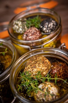 RECIPE FOR LABNEH CHEESE BOLLS WITH DRY MINT, BLACK AND WHITE SESAME, SUMAC AND ZAATAR IN A JAR WITH OLIVE OIL. High quality photo
