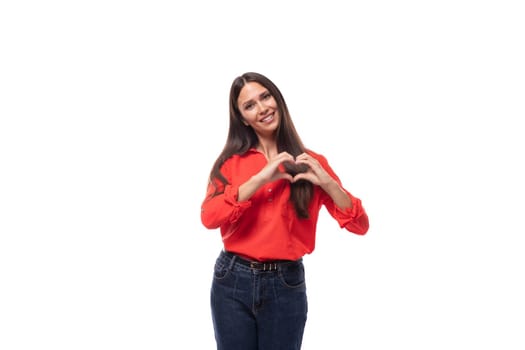 pretty confident successful young brunette business woman dressed in a red blouse on a white background with copy space.