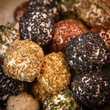 RECIPE FOR LABNEH CHEESE BOLLS WITH DRIED MINT, WHITE AND BLACK SESAME, SUMAC AND ZAATAR. High quality photo