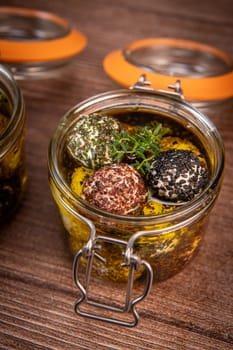 RECIPE FOR LABNEH CHEESE BOLLS WITH DRY MINT, BLACK AND WHITE SESAME, SUMAC AND ZAATAR IN A JAR WITH OLIVE OIL. High quality photo