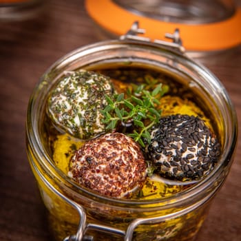 RECIPE FOR LABNEH CHEESE BOLLS WITH DRY MINT, BLACK AND WHITE SESAME, SUMAC AND ZAATAR IN A JAR WITH OLIVE OIL. High quality photo