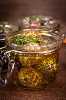 RECIPE FOR LABNEH CHEESE BOLLS WITH DRY MINT, BLACK AND WHITE SESAME, SUMAC AND ZAATAR IN A JAR WITH OLIVE OIL. High quality photo