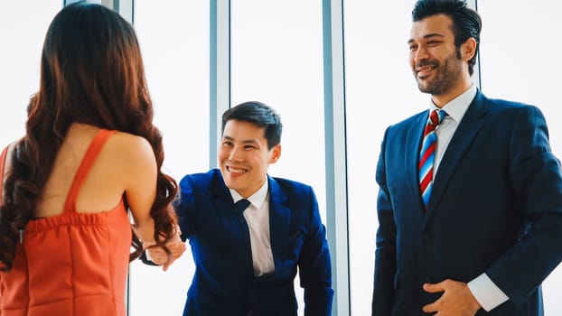 Job seeker and manager handshake in job interview meeting at corporate office. The young interviewee seeking for a professional career job opportunity . Human resources and recruitment concept. Jivy