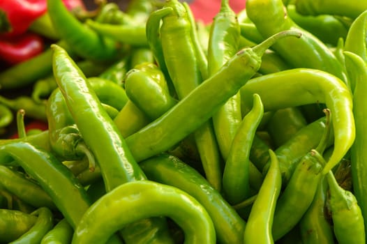 fresh appetizing green hot peppers at the bazaar on the island of Cyprus in autumn 2