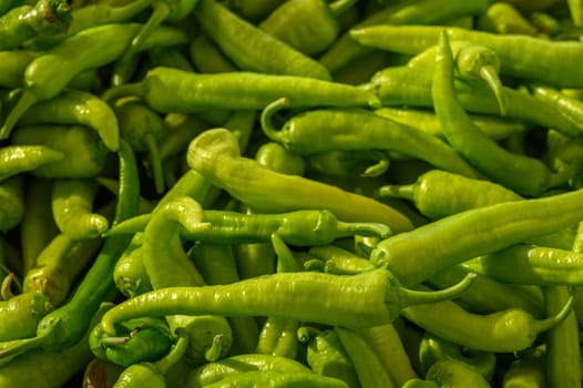 fresh appetizing green hot peppers at the bazaar on the island of Cyprus in autumn 1