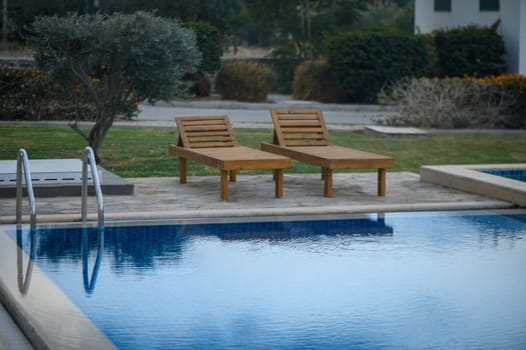 swimming pool near a house in a residential complex at sunset 1