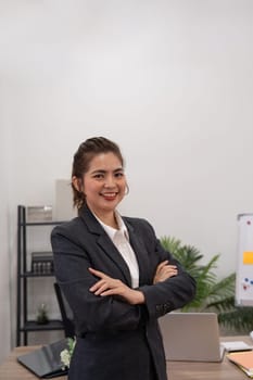 Confident smile businesswoman young asian, company sale marketing manager, standing arms crossed in office.