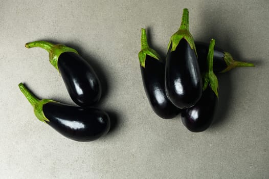 appetizing eggplants on a stone background