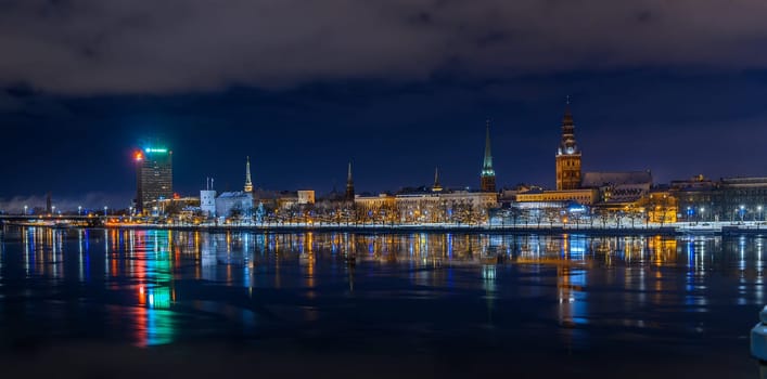 panorama of Old Riga evening view and illumination across the river