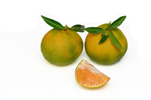 delicious fresh green-orange tangerines on a white background