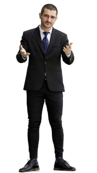 young man in full growth. isolated on white background demonstrates with hands.