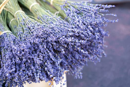 Dried lavender flowers with bracts, lamiaceae mint family plant. Light purple colour. Pattern of small natural violet elements. Aromatic mediterranean product.
