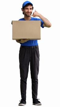 full-length male courier holding a box on a white background.