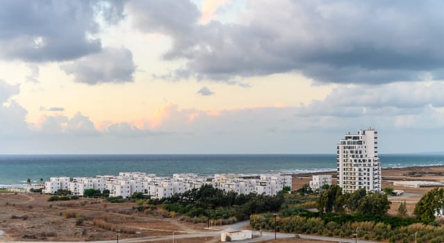view of a residential complex near the sea from the roof of a neighboring building