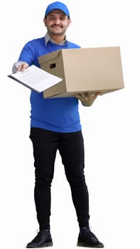 full-length male courier holding a box on a green background.