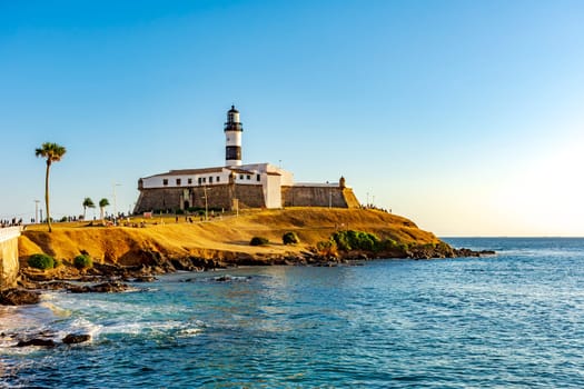 Sunset at the famous Farol da Barra in the city of Salvador, Bahia