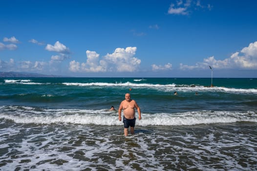 a man emerges from the Mediterranean sea on a sunny day 1