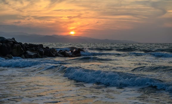 shore of the Mediterranean sea autumn 2023 in the setting sun 11