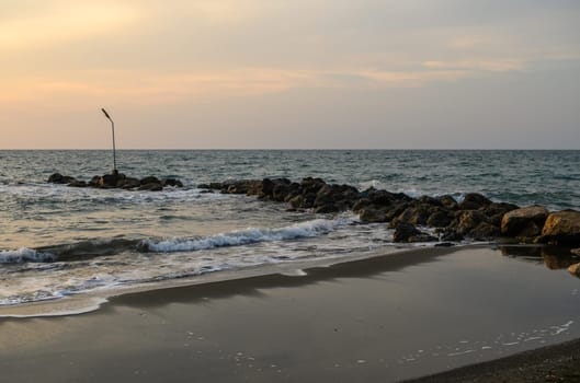 shore of the Mediterranean sea autumn 2023 in the setting sun