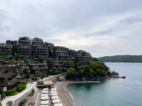 Sandy beach near the hotel Dukley on a hill above the sea. Montenegro. High quality photo