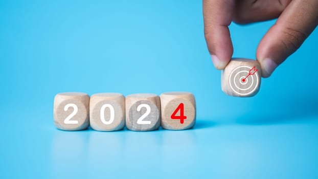 Wooden blocks lined up with the letters 2024. Represents the goal setting for 2024, the concept of a start. financial planning development strategy business goal setting