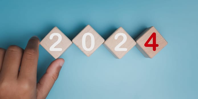 Wooden blocks lined up with the letters 2024. Represents the goal setting for 2024, the concept of a start. financial planning development strategy business goal setting