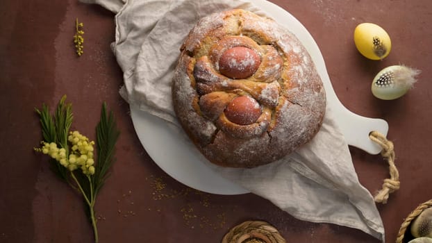 Easter folar with egg on wooden table top.