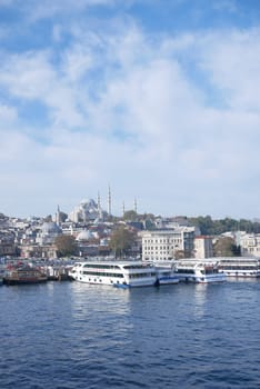 Turkey istanbul 19 june 2023. ferryboats parked in the waters of the Bosphorus river nearby the Eminonu Mosque,