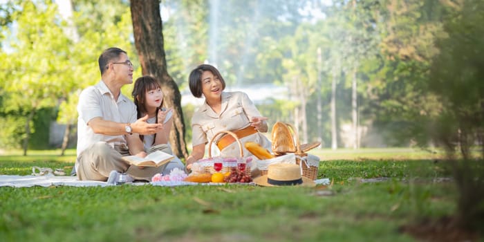 Grandparent playing togetherness with a granddaughter in the park in the morning. Family, love and grandchild bonding with grandfather and grandma in a park. concept child and senior.