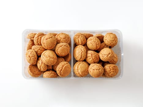 Box of cookie amaretti on white background - traditional Italian Sardinian pastry. Delicious amaretti biscuit cookies with copy space