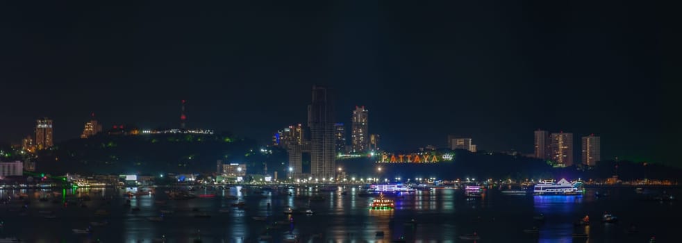 Pattaya Thailand, a view of the city skyline at night with hotels and skyscrapers buildings.