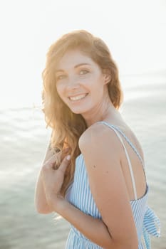 a holiday beach summer portrait woman by the sea walk