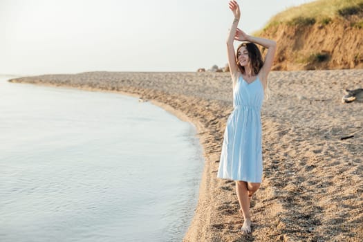 a rest beach summer woman walks along the seashore walk