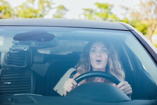 the woman behind the wheel of the car was frightened