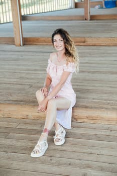 a woman sitting on wooden steps walking rest