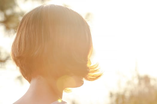 The sun that the woman's hair turned back