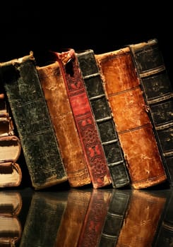 Set of various old books on black background