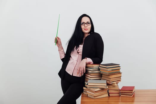 a woman with pointer teacher in books in library teaching science education