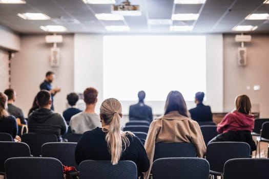 Conference and Presentation. Audience at the conference hall. Business and Entrepreneurship. Faculty lecture and workshop. Audience in the lecture hall. Academic education. Student making notes.