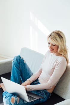 a remote work woman with laptop computer internet conversation online communication communication in the room