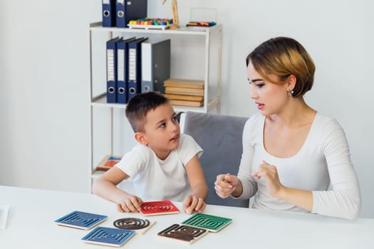 a teacher with boy in school training development