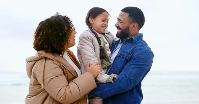 Happy family, hug child and love by beach, nature or support to relax on calm holiday. Young man, woman and daughter with bonding for care, marriage and vacation in rio de janeiro for peace wellness.