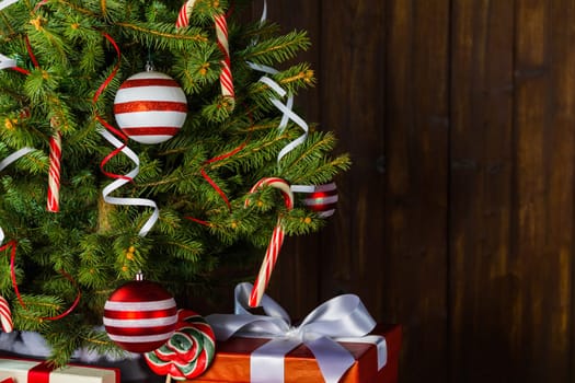 Decorated Christmas tree and gift boxes background