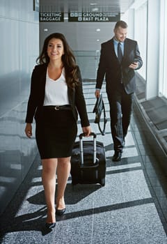 Walking, journey or business people in airport with suitcase, luggage or baggage for a global trip. Smile, happy woman or corporate workers in lobby for travel or transport on international flight.