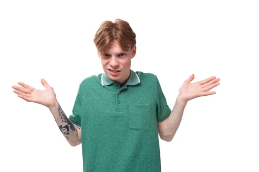 young european man with red hair and stylish hairstyle is having doubts and thinking about an idea.