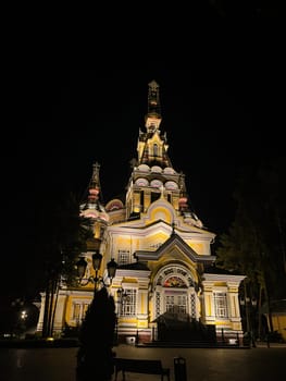 Orthodox Cathedral in the park in Almaty at night.