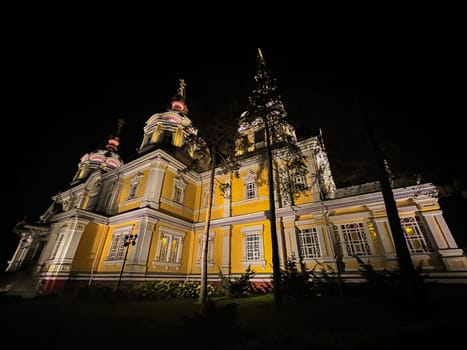 Orthodox Cathedral in the park in Almaty at night.