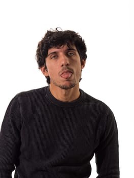 A man making a funny face sticking out his tongue to the camera, isolated on white