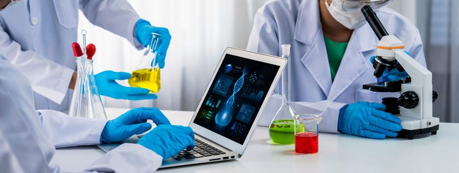 Laboratory research team advance healthcare with scientific expertise, laboratory equipment, and innovative medical biotechnology software, researching new medicines and developing cure.Panorama Rigid